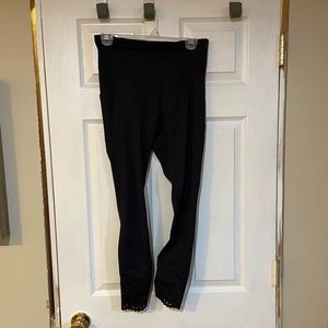 Black workout leggings with eyelet details